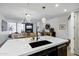 Kitchen island features marble countertops, black sink, and pendant lighting at 120 E Rio Salado Pkwy # 101, Tempe, AZ 85281