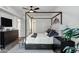 This main bedroom features a four-poster bed, an accent wall decoration, and hardwood floors at 120 E Rio Salado Pkwy # 101, Tempe, AZ 85281