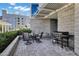Cozy patio boasts a beautiful hardscaped brick flooring with an outdoor grill and dining table at 120 E Rio Salado Pkwy # 101, Tempe, AZ 85281