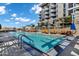 Resort style pool with lounge chairs, umbrellas, and building in background on a sunny day at 120 E Rio Salado Pkwy # 101, Tempe, AZ 85281