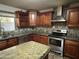 Kitchen showcases granite countertops, stainless steel appliances, tile backsplash, and lots of cabinets at 12733 W Boca Raton Rd, El Mirage, AZ 85335