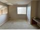 Spacious loft with window and a built-in desk at 12733 W Boca Raton Rd, El Mirage, AZ 85335
