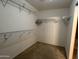 Walk-in closet features wire shelving for storage and organization at 12733 W Boca Raton Rd, El Mirage, AZ 85335