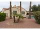 Backyard featuring desert landscaping, mature palm trees and pool with covered patio at 13417 W La Vina Dr, Sun City West, AZ 85375