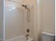 Standard bathtub and shower featuring white wall panels, basic faucet and shower head at 13417 W La Vina Dr, Sun City West, AZ 85375