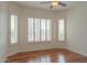 Bright bedroom with plantation shutters overlooking a pool at 13417 W La Vina Dr, Sun City West, AZ 85375