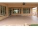 Spacious covered patio with ceiling fan and outdoor dining space at 13417 W La Vina Dr, Sun City West, AZ 85375