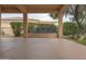 Covered patio featuring an outdoor stone fountain and desert landscaping at 13417 W La Vina Dr, Sun City West, AZ 85375