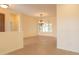 Spacious dining area featuring tile flooring, large windows with shutters, and an elegant chandelier at 13417 W La Vina Dr, Sun City West, AZ 85375