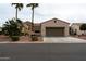 Single-story home with desert landscaping, stone accents and a two-car garage at 13417 W La Vina Dr, Sun City West, AZ 85375