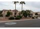 Charming home featuring desert landscaping, mature palm trees and stone accents at 13417 W La Vina Dr, Sun City West, AZ 85375