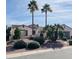 Charming home featuring desert landscaping, mature palm trees and stone accents at 13417 W La Vina Dr, Sun City West, AZ 85375