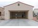 Spacious two car garage featuring built in storage and epoxy flooring at 13417 W La Vina Dr, Sun City West, AZ 85375