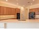 Open concept kitchen with granite counters and stainless steel appliances at 13417 W La Vina Dr, Sun City West, AZ 85375