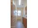 Functional laundry room with tile flooring, front loading washer and dryer, and built-in cabinets at 13417 W La Vina Dr, Sun City West, AZ 85375