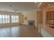 Inviting living room with a fireplace, built-in shelving, and natural light at 13417 W La Vina Dr, Sun City West, AZ 85375