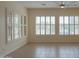 Living room with custom shutters overlooking backyard at 13417 W La Vina Dr, Sun City West, AZ 85375
