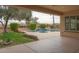 Covered patio with view of the pool, spa and backyard at 13417 W La Vina Dr, Sun City West, AZ 85375