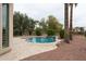 Private pool and spa featuring a small waterfall and desert landscaping at 13417 W La Vina Dr, Sun City West, AZ 85375