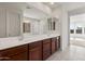 Double-sink bathroom vanity with ample counter space and plentiful storage at 13803 W Calle De Baca --, Peoria, AZ 85383