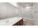 Bathroom featuring double sinks, modern faucets, and a shower-tub combo at 13803 W Calle De Baca --, Peoria, AZ 85383