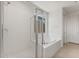 A bathroom features a glass-enclosed shower next to a soaking tub at 13803 W Calle De Baca --, Peoria, AZ 85383