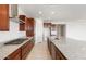 Spacious kitchen features a granite countertop, stainless steel appliances, and wood cabinetry at 13803 W Calle De Baca --, Peoria, AZ 85383