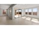 Sun-filled living area with a sliding door leading to the patio with tile flooring throughout at 13803 W Calle De Baca --, Peoria, AZ 85383