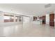 Spacious living area with tile flooring, modern kitchen, and plenty of natural light at 13803 W Calle De Baca --, Peoria, AZ 85383