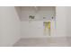 Utility room featuring tile floor, hookups for a washer/dryer, and shelving at 13803 W Calle De Baca --, Peoria, AZ 85383