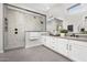 Modern bathroom featuring a large glass shower and double vanity with stylish fixtures at 17450 W Via Dona Rd, Surprise, AZ 85387