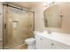 Updated bathroom featuring a glass-enclosed shower and modern vanity with a framed mirror at 18051 N 88Th Dr, Peoria, AZ 85382