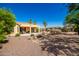 Well-maintained backyard with desert landscaping and covered patio perfect for outdoor relaxation at 1822 N 164Th Dr # 58, Goodyear, AZ 85395