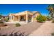 Covered patio, desert landscaping, and a well-maintained yard for outdoor living at 1822 N 164Th Dr # 58, Goodyear, AZ 85395
