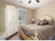 Bedroom featuring a bed, wardrobe, shutters, and neutral walls at 1822 N 164Th Dr # 58, Goodyear, AZ 85395