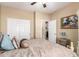 Comfortable bedroom with closet doors, neutral walls, and an attractive accent painting at 1822 N 164Th Dr # 58, Goodyear, AZ 85395