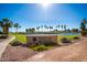 PebbleCreek community entrance with serene water feature and lush landscaping, a Robson Resort Community at 1822 N 164Th Dr # 58, Goodyear, AZ 85395