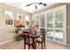 Charming dining area with lots of natural light through the louvered sliding glass doors at 1822 N 164Th Dr # 58, Goodyear, AZ 85395