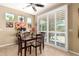 Charming dining area with lots of natural light through the louvered sliding glass doors at 1822 N 164Th Dr # 58, Goodyear, AZ 85395