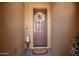 Inviting front door with decorative wreath, charming decor, and warm, neutral tones at 1822 N 164Th Dr # 58, Goodyear, AZ 85395