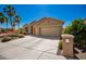 Inviting home with desert landscaping, three-car garage and a well-manicured front yard at 1822 N 164Th Dr # 58, Goodyear, AZ 85395
