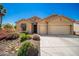 Charming single-story home with a well-maintained yard and a three-car garage at 1822 N 164Th Dr # 58, Goodyear, AZ 85395