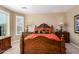 The main bedroom has a large bed, and two nightstands at 1822 N 164Th Dr # 58, Goodyear, AZ 85395