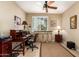 Home office featuring built-in storage, neutral paint, and a ceiling fan at 1822 N 164Th Dr # 58, Goodyear, AZ 85395