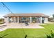 Wide view of an attractive patio, backyard, and built-in grill at 18637 E Flintlock Dr, Queen Creek, AZ 85142