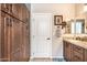 Bathroom featuring granite counters, dual sinks, and attractive wood cabinets at 18637 E Flintlock Dr, Queen Creek, AZ 85142