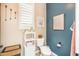 Comfortable half bathroom featuring attractive color scheme and shelving at 18637 E Flintlock Dr, Queen Creek, AZ 85142