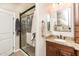 Bright bathroom showcasing a glass enclosed shower, a granite countertop vanity, and tile floors at 18637 E Flintlock Dr, Queen Creek, AZ 85142