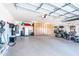 Expansive three car garage with wall to wall storage cabinets and bright lighting at 18637 E Flintlock Dr, Queen Creek, AZ 85142