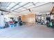 Spacious three car garage with epoxy floors and wall to wall built-in storage cabinetry at 18637 E Flintlock Dr, Queen Creek, AZ 85142